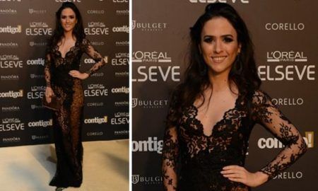 vestido de renda preto com fundo bege